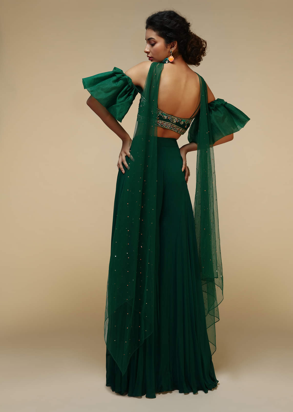 Bottle Green Palazzo Suit With A Cold Shoulder Crop Top Featuring Short Bell Sleeves And Multi Colored Hand Embroidery  