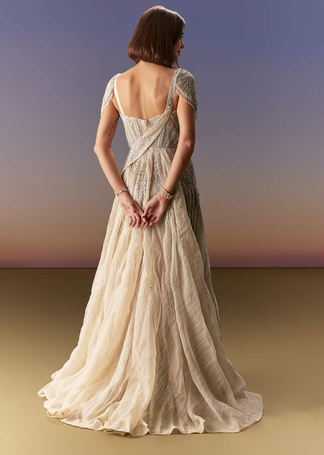 Grey Gown With Draped Cap Sleeves And Flowing Embroidered Flare