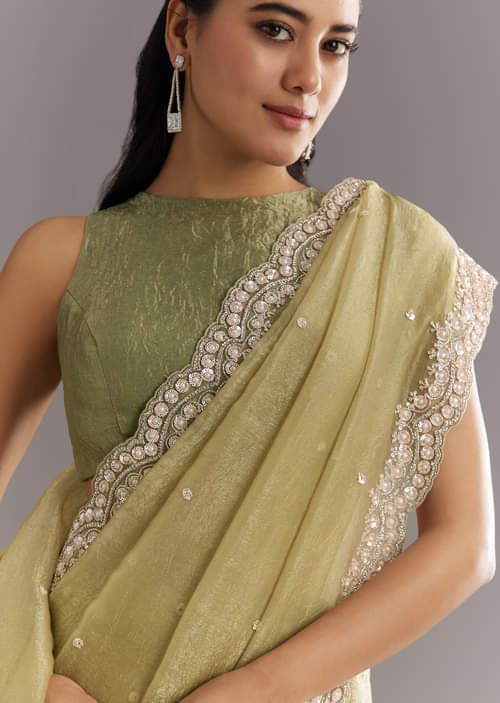 Light Green Glossy Crushed Tissue Saree With Cutdana Sequins Embroidery And Scallop Border