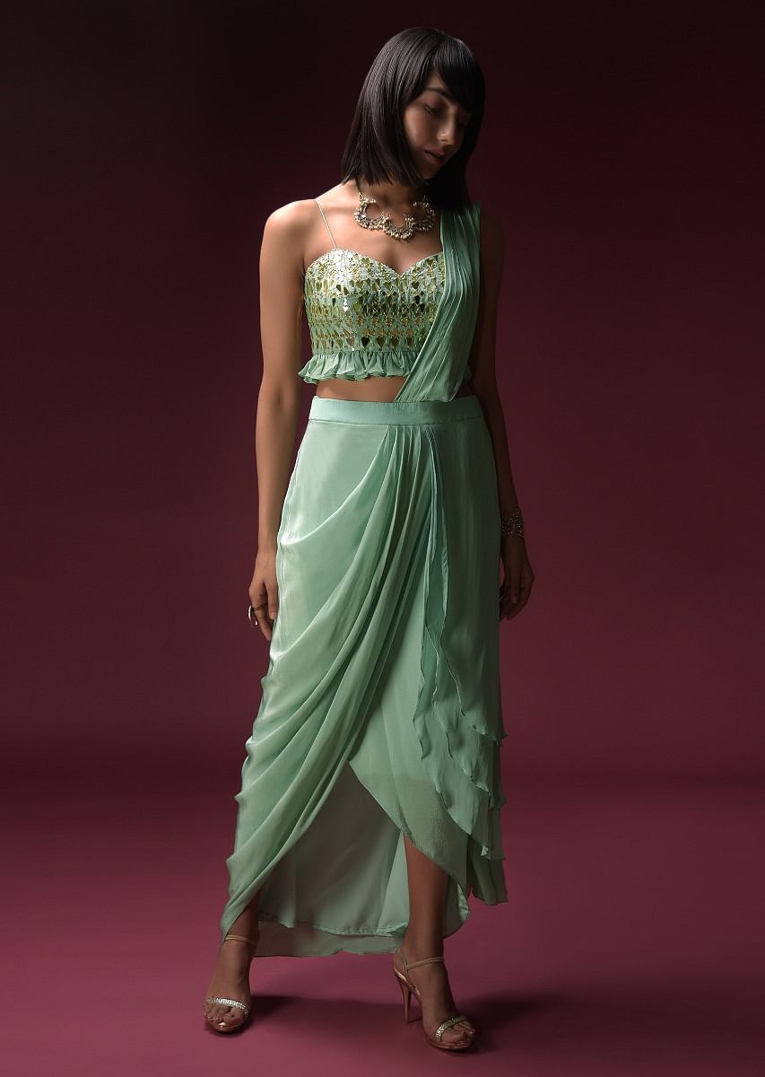 Buy Mint Blue Dhoti Skirt With Attached Saree Drape And Ruffled Crop Top Adorned With Flower Shaped Mirror Work Online Kalki Fashion