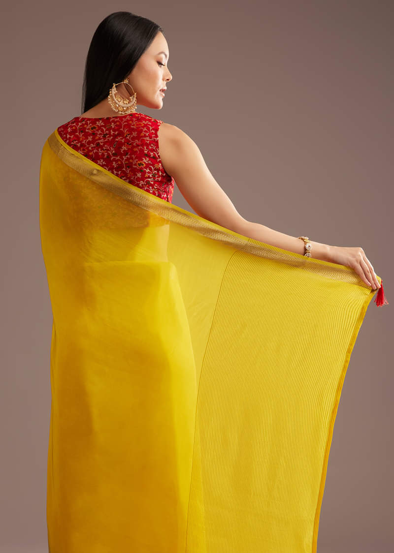Mustard Yellow Crepe Silk Saree With Zari Border And Contrast Blouse