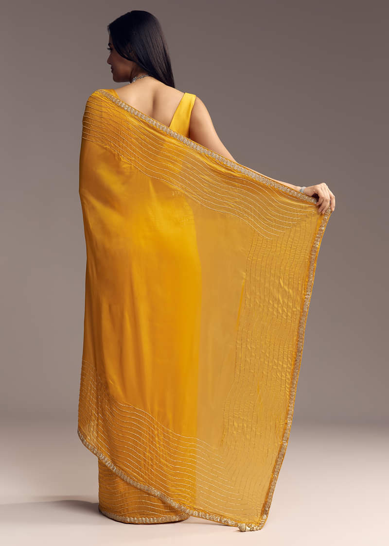 Mustard Yellow Organza Saree With Scallop Border And Stone Work