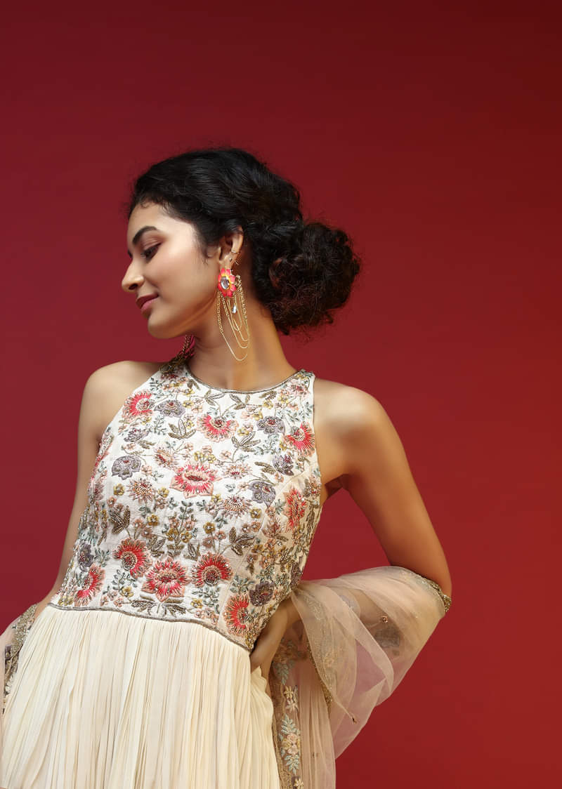 Off White Anarkali Suit With Halter Neckline And Adorned In Multicolored Hand Embroidered Floral Design On The Bodice  
