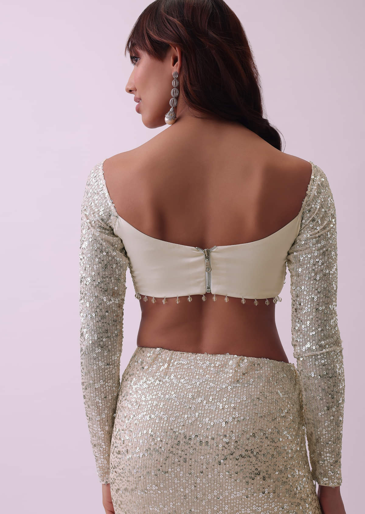Off-White Sequins Saree And Blouse With Cowl Sleeves And Tassels