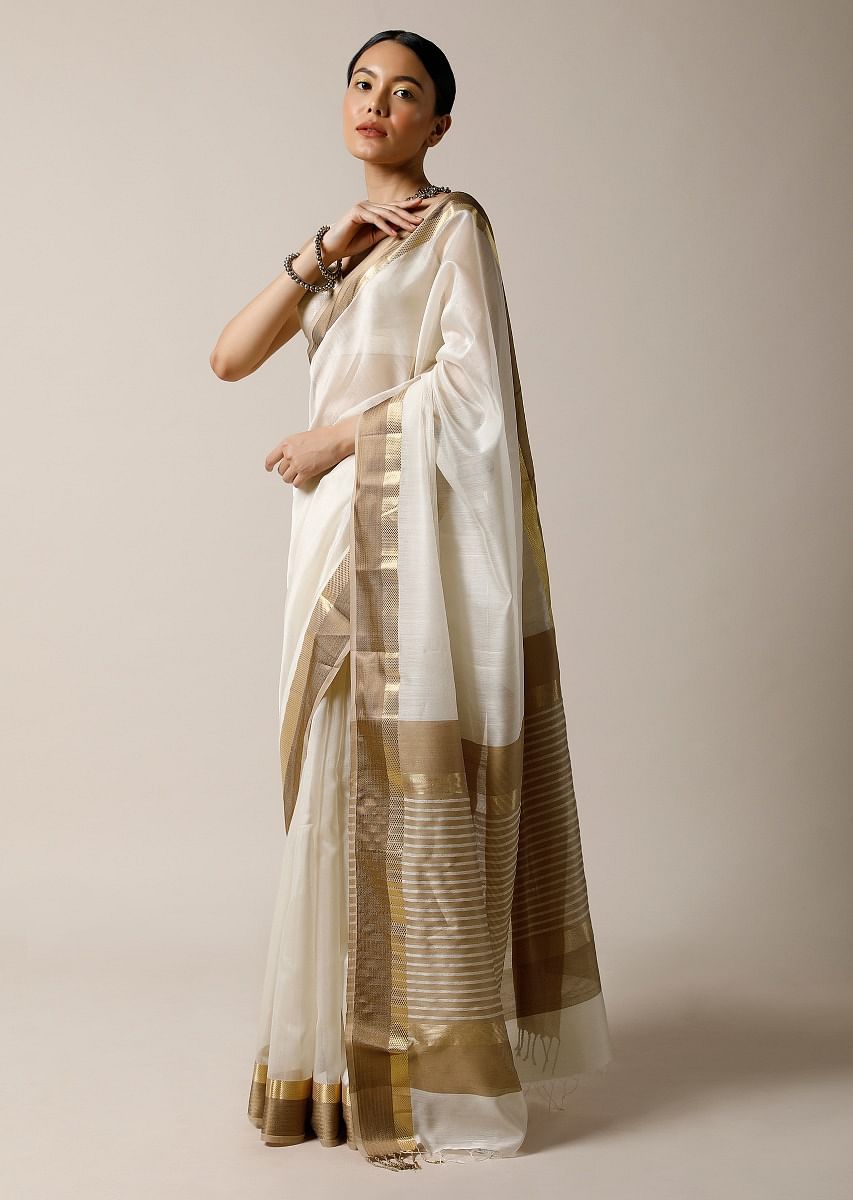 Off white silk saree with golden border best sale