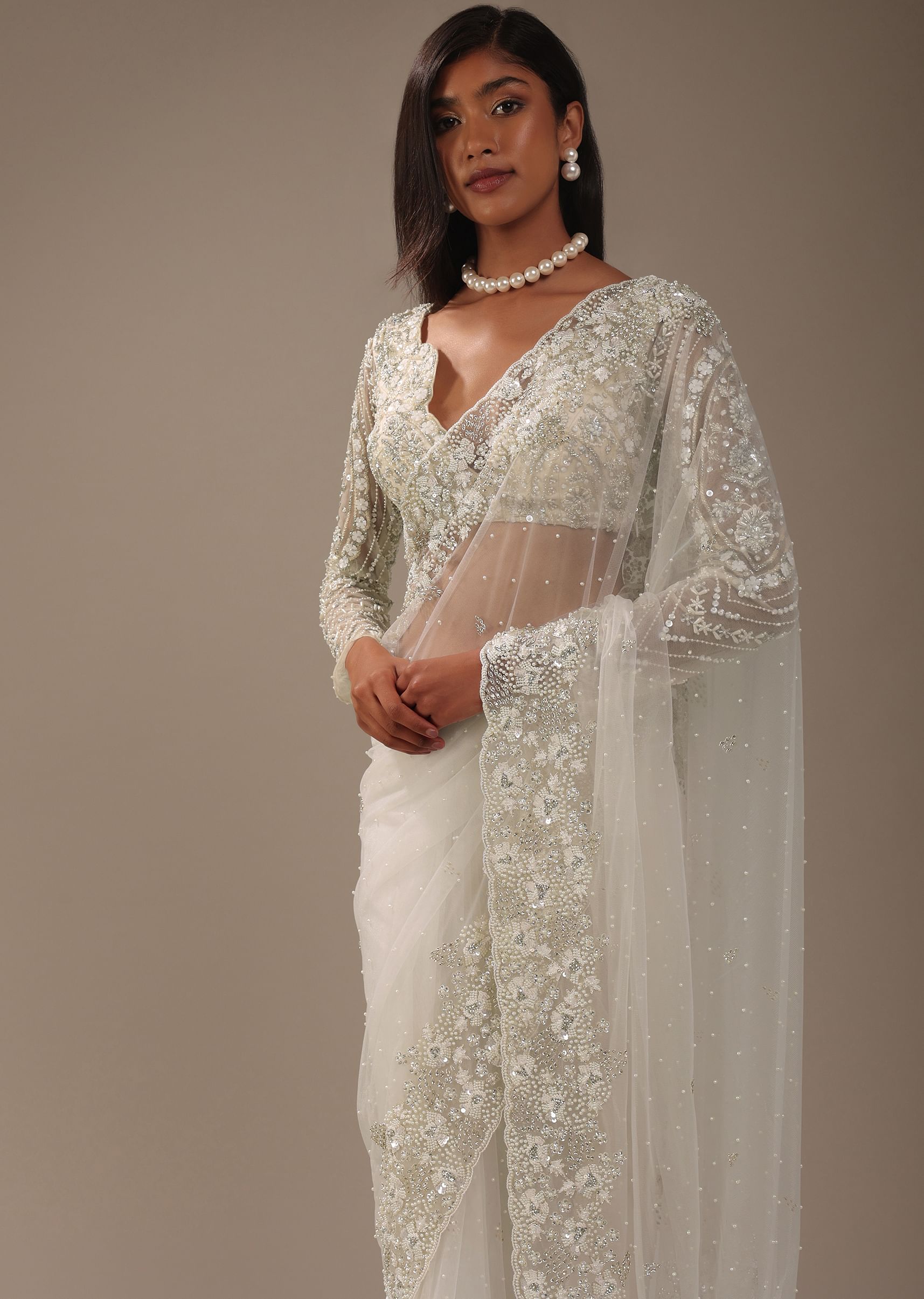 Off white embroidered net saree shop