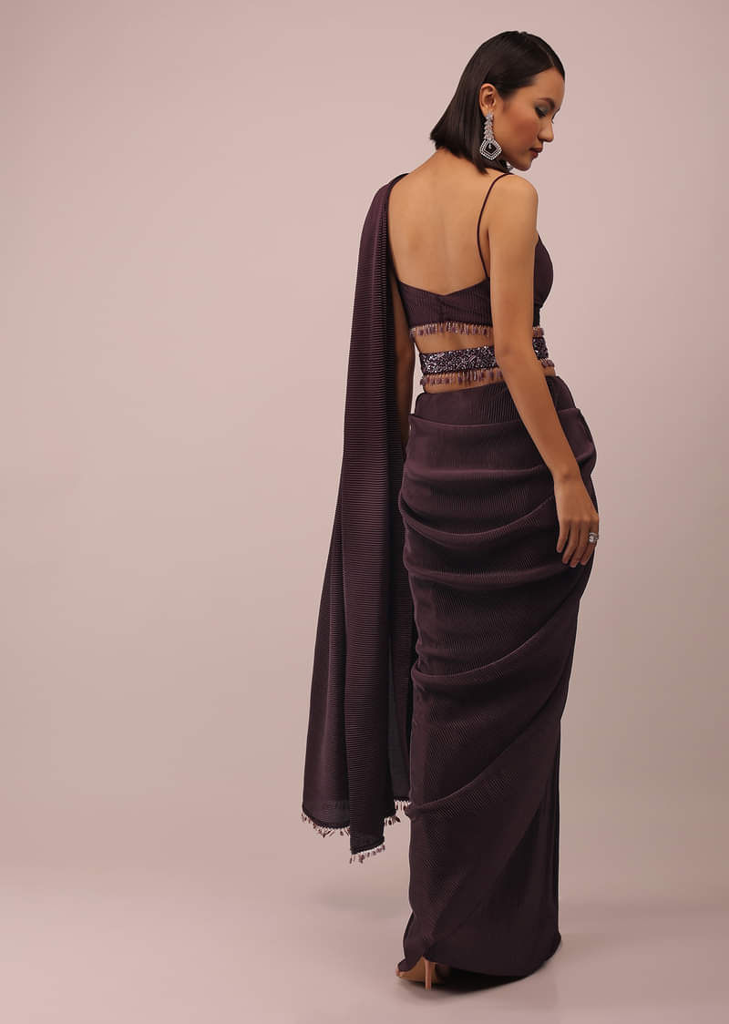 Plum Saree With Moti And Cut Dana Fringes Detailing On The Pallu And A Spaghetti Straps Crop Top With An Embroidered Belt In Fringes