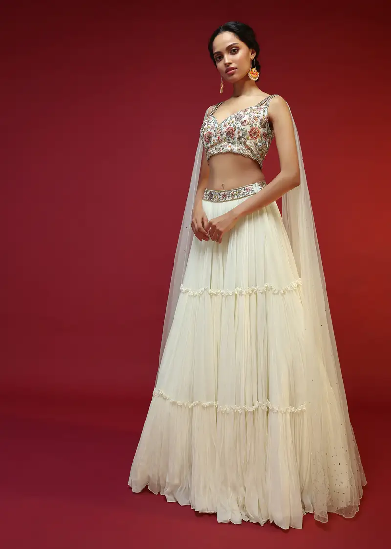 Powder White Lehenga Choli With Attached Cape And Hand Embroidery Using Colorful Resham And Sequins In Floral Motifs 