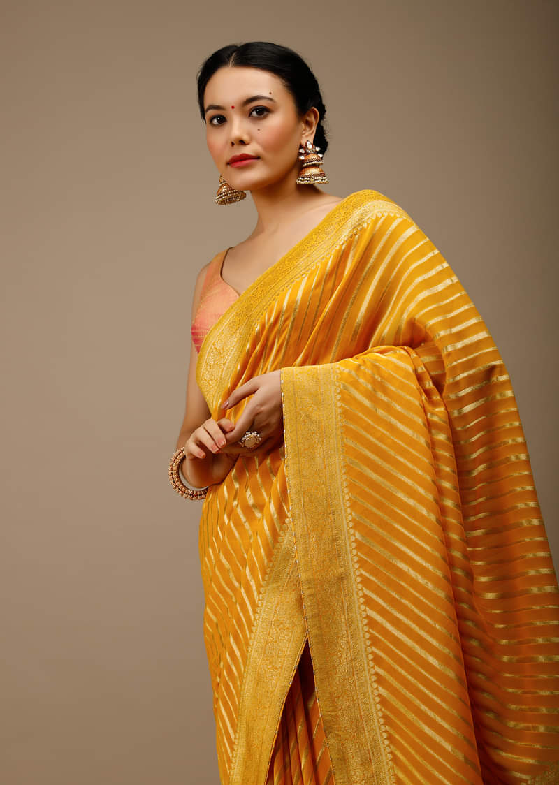 Radiant Yellow Saree In Georgette With Brocade Woven Diagonal Stripes And Floral Border  