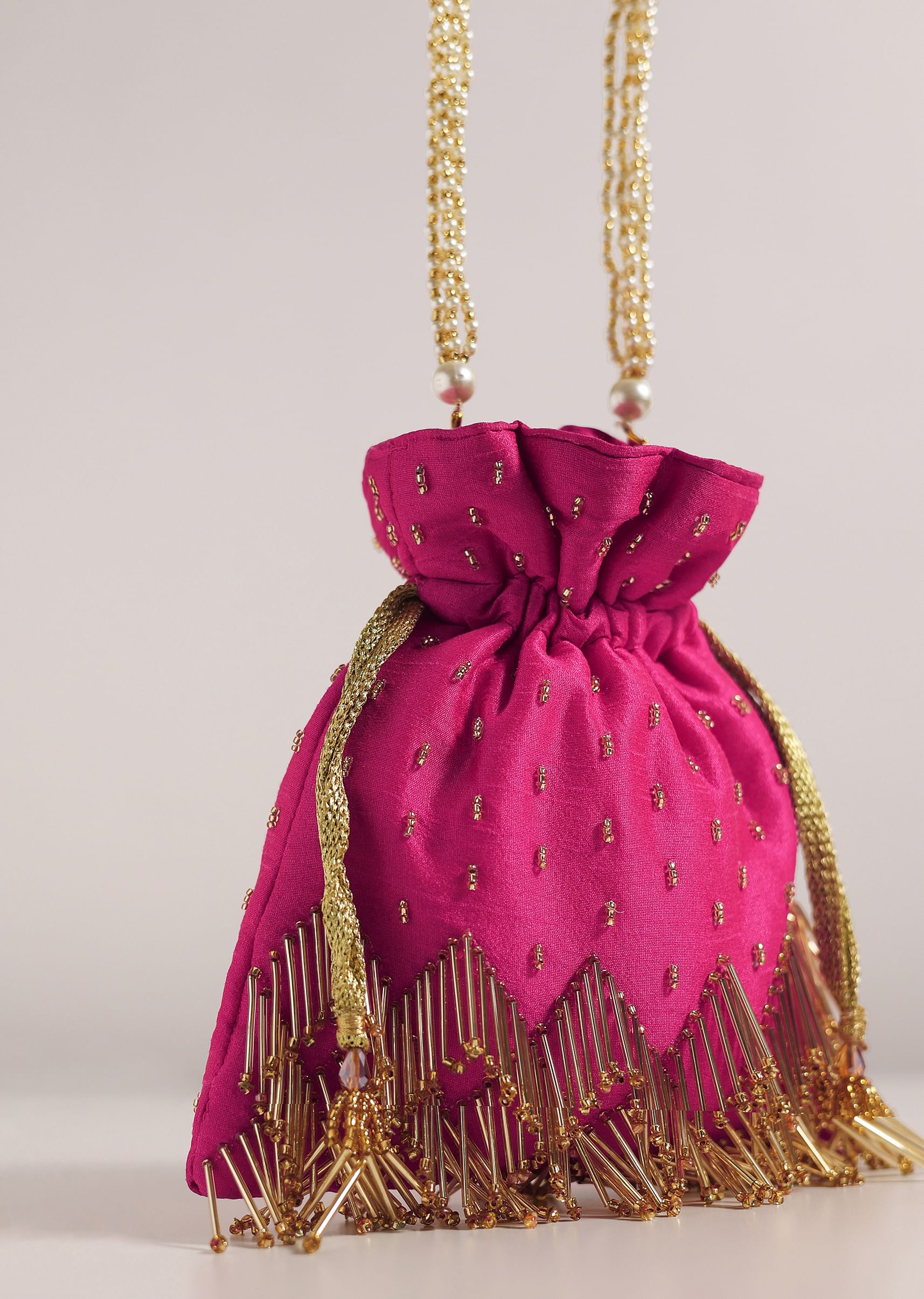 Buy Rose Red Potli Bag With Tassels And A Handworked Handle