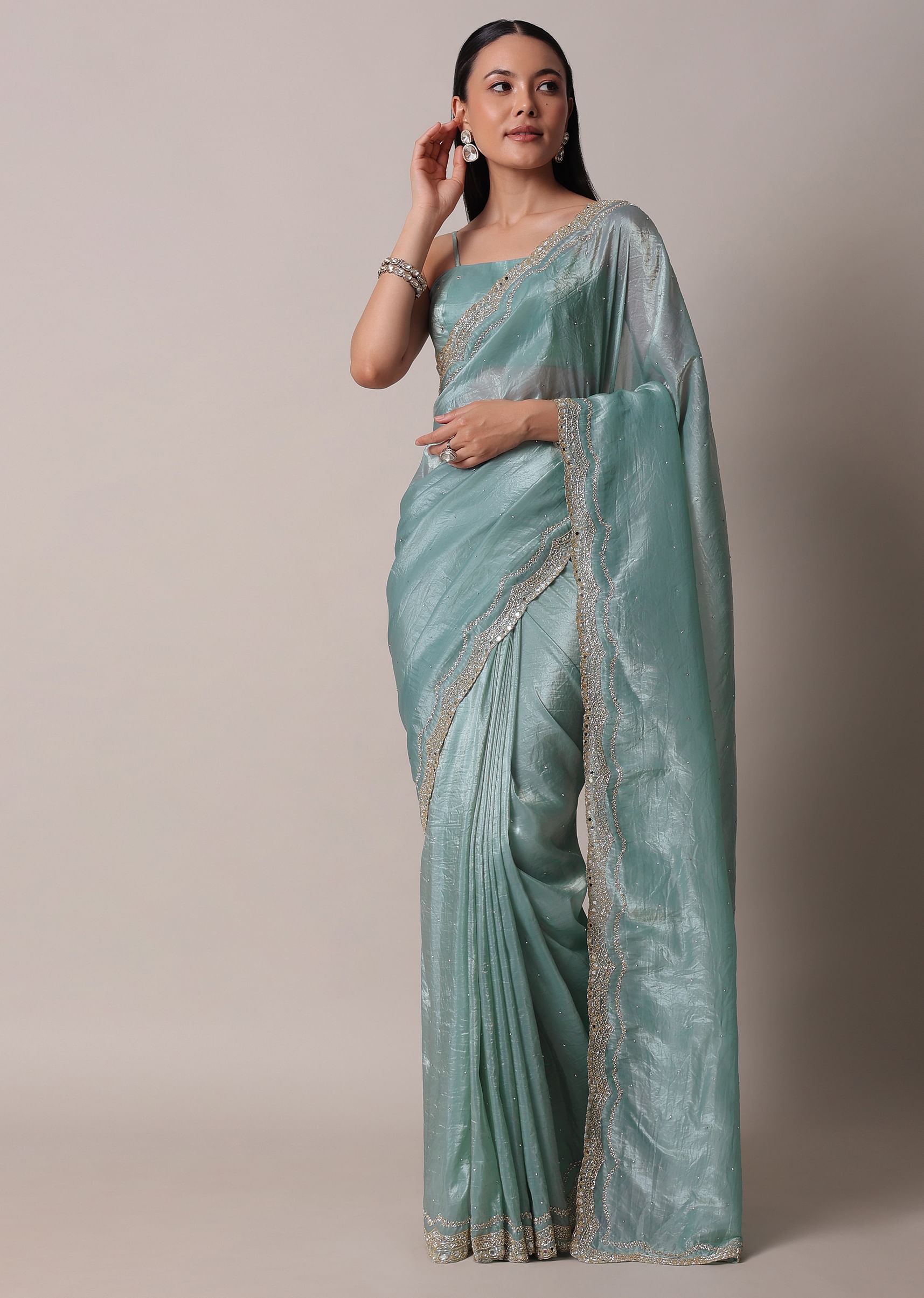 Green Tissue Saree with Stitched outlets Blouse