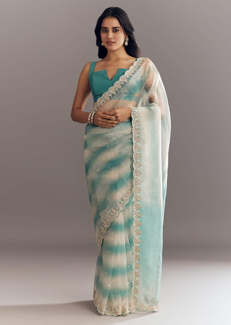 teal-blue-shaded-organza-saree-with-moti-stone-sequins-embroidery-and-cutwork-scallop-border-sg292893-1.jpg?w=800