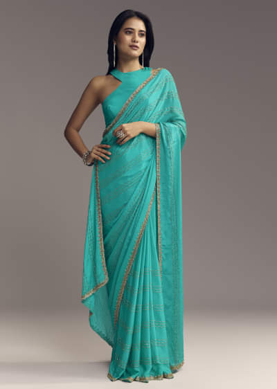Turquoise Blue Embroidered Chinon Saree With Wavy Border